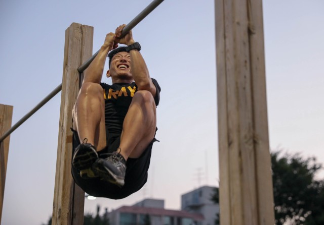 Spc. Hwui Yoo, a language analyst assigned to the 719th Military Intelligence Battalion, 501st MI Brigade, conducts a leg-tuck during the Army Combat Fitness Test stage of the United States Army Pacific Command Best Warrior Competition at Camp...