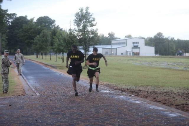 Sergeant Marlon Smith, Arkansas Army National Guard, and Specialist Skylar Pierre, Louisiana Army National Guard, push each other with a race to the finish during the two mile run as part of the Army Combat Fitness Test. The ACFT was held Aug. 28...