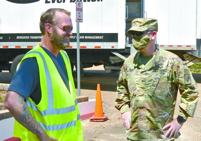 Michel E. Buterbaugh, Mobilization Program manager (left), visits with Brig. Gen. Patrick D. Frank, commander, Joint Readiness Training Center and Fort Polk, at a Red Cross distribution point at the installation’s Siegfried Youth Activity...