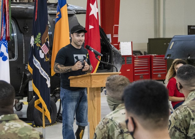 U.S. Army veteran, musical performer and double amputee Justin (JP) Lane addresses a group of U.S. Army Advanced Individual Training students at a military resiliency training session aimed at bringing awareness to suicide prevention within the...