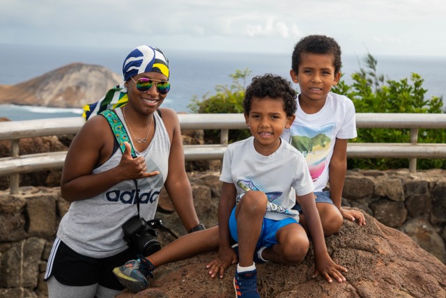 Sgt. 1st Class Monique Rincon, the Intelligence Non-Commissioned Officer in Charge, assigned to the 94th Army Air and Missile Defense Command, smiles for a picture with her sons Quentin (middle) and Cameron (right) as they take a break at the top of Makapu’u Point Lighthouse Trail, Hawaii.