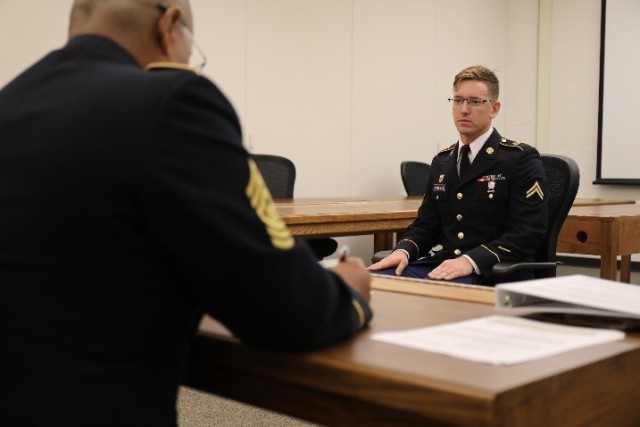 Cpl. Jonathon Gallegos, Kansas Army National Guard, sits in front of a traditional appearance board covering questions from the non-commissioned officer and Soldiers guides.  This was one of the final tasks for phase two of the 2020 Region V Best...