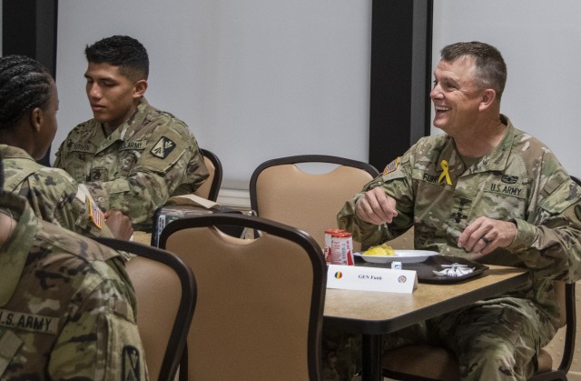 Gen. Paul E. Funk II, commanding general U.S. Army Training and Doctrine Command (right), has breakfast with Advanced Individual Training students during a resiliency breakfast at Fort Eustis, Va., Sept. 11, 2020. (U.S. Army photo by David Overson)