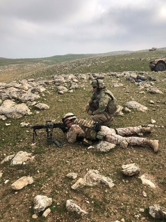 Capt. Joseph Kinsey of Battery C, 1st Battalion, 161st Field Artillery Regiment, 130th Field Artillery Brigade Artillery, Kansas Army National Guard out of Newton, Kansas, conducts multi-national weapons familiarization with an Italian soldier...
