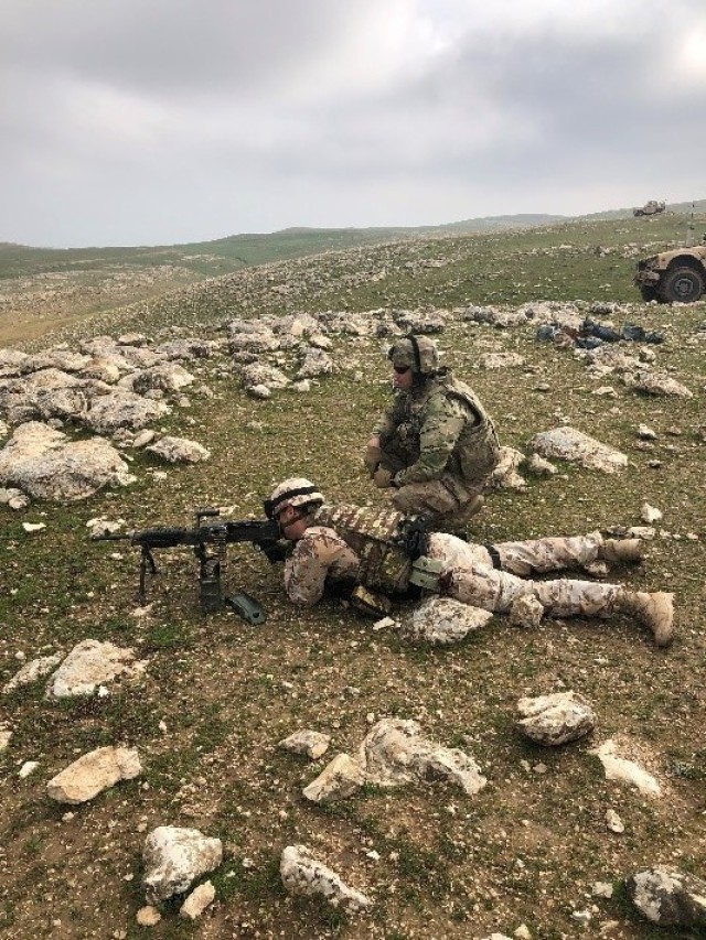 Capt. Joseph Kinsey of Battery C, 1st Battalion, 161st Field Artillery Regiment, 130th Field Artillery Brigade Artillery, Kansas Army National Guard out of Newton, Kansas, conducts multi-national weapons familiarization with an Italian soldier February 2019 at the Mosul Dam in Iraq. (Photo by U.S Army National Guard Spc. William Polly)