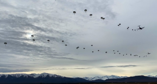 Paratroopers from the 4th Brigade Combat Team (Airborne), 25th Infantry Division, “Spartan Brigade,” execute a joint forcible entry operation into Donnelly Training Area, Alaska, Sept. 14, 2020. More than 250 Paratroopers participated as part of a U.S. Army Pacific exercise that included the movement of an M142 High Mobility Artillery Rocket System from the 17th Fires Brigade based at Joint Base Lewis-McChord to Shemya Island, along with air support from Joint Base Elmendorf-Richardson F-22 fighter jets. The exercise demonstrated the capability of U.S. military forces in the Pacific theater to work together across vast distances to project force as needed to bolster safety and stability in the region. (Photo courtesy of U.S. Army Pfc. Colton Eller, Comanche Co., 1st Battalion, 501st Parachute Infantry Regiment, 4th Infantry Brigade Combat Team (Airborne), 25th Infantry Division)
