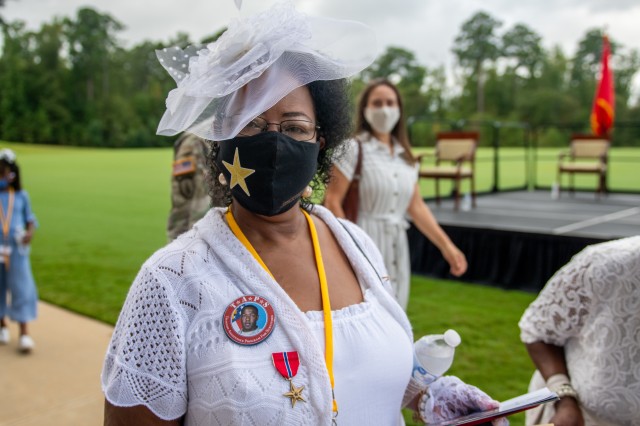 Janet George-Morris wears her son's Bronze Star medal. Nearly 100 Gold Star families joined the Fort Benning community for the rededication of the Global War on Terrorism Memorial Sept. 12 at the National Infantry Museum. The memorial was...