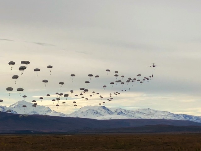 Paratroopers from the 4th Brigade Combat Team (Airborne), 25th Infantry Division, “Spartan Brigade,” execute a joint forcible entry operation into Donnelly Training Area, Alaska, Sept. 14, 2020. More than 250 Paratroopers participated as part of a U.S. Army Pacific exercise that included the movement of an M142 High Mobility Artillery Rocket System from the 17th Fires Brigade based at Joint Base Lewis-McChord to Shemya Island, along with air support from Joint Base Elmendorf-Richardson F-22 fighter jets. The exercise demonstrated the capability of U.S. military forces in the Pacific theater to work together across vast distances to project force as needed to bolster safety and stability in the region. (Photo courtesy of U.S. Army Pfc. Colton Eller, Comanche Co., 1st Battalion, 501st Parachute Infantry Regiment, 4th Infantry Brigade Combat Team (Airborne), 25th Infantry Division)
