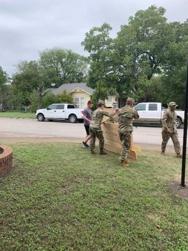 Soldiers, community support Adopt-a-School