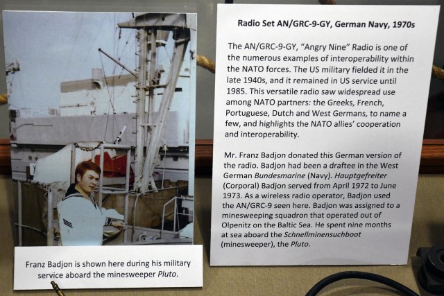 WIESBADEN, Germany – Franz Badjon is shown in a picture in the Mission Command Center during his military service aboard the minesweeper Pluto. The German national from Malmsheim near Stuttgart donated a historic German navy Cold War era radio...