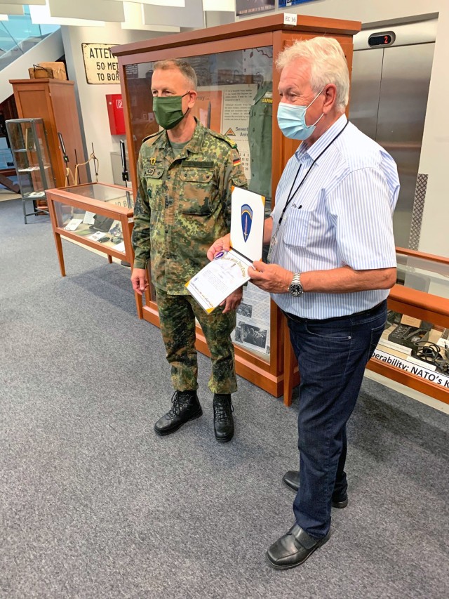 WIESBADEN, Germany – Franz Badjon shows off his certificate of appreciation Aug. 20 in the U.S. Army Europe Museum in the Mission Command Center on Clay Kaserne. He was awarded the certificate and a coin by U.S. Army Europe Chief of Staff Brig....