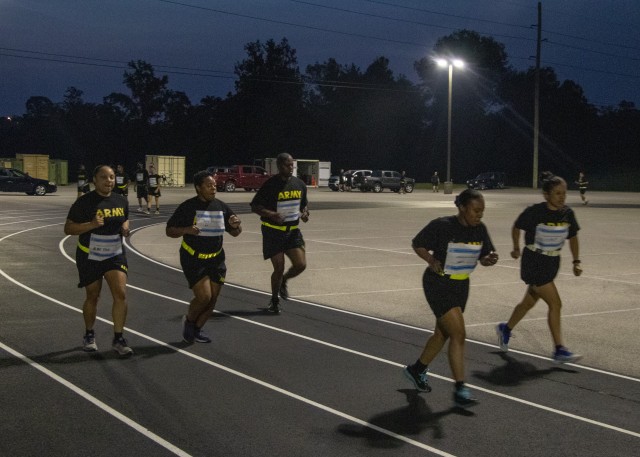 Soldiers with the 1st Theater Sustainment Command run laps during the Dedicate Your Run/Walk event Sept. 10, 2020 at Fort Knox, Kentucky. During the event, participants dedicated the number of miles they ran or walked to a survivor of sexual assault as a show of support. The event took place to raise awareness of the approximately 7825 cases of sexual assault and harassment across the Department of Defense. (U.S. Army photo by Spc. Zoran Raduka, 1st TSC Public Affairs)