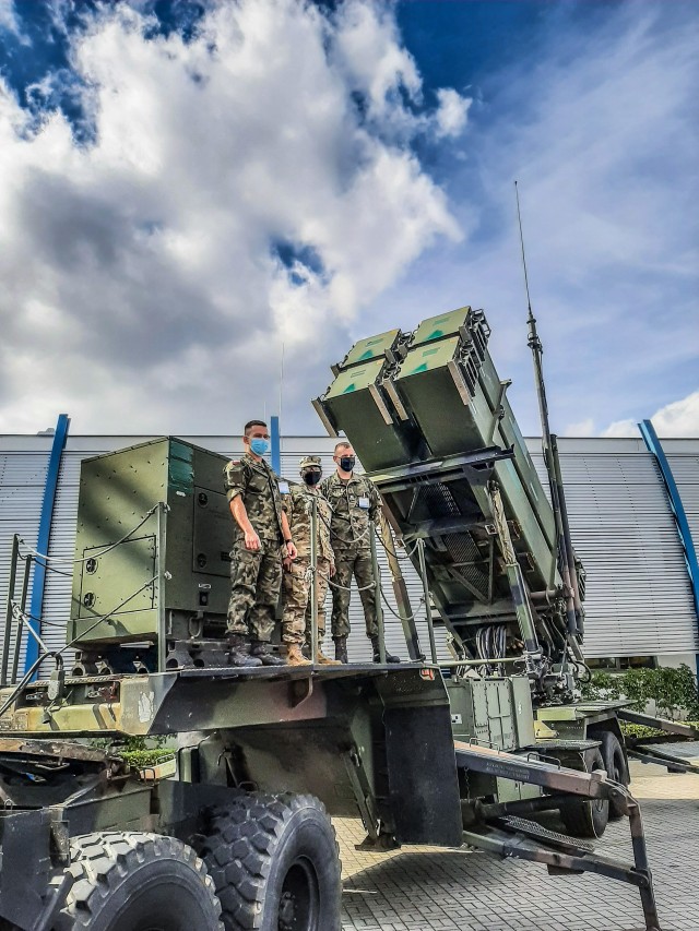 1st Lt. Rehema Kabiru from Alpha Battery, 5th Battalion, 7th Air Defense Artillery Regiment with Polish soldiers on a Patriot Launching System at the 28th International Defense Industry Exhibition MSPO 2020 on Sept 8, 2020 in Targi Kielce, Poland.