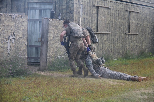 Members of the 807th Medical Command of Salt Lake City, Utah, evacuate a medical mannequin during a training scenario during the unit's 68W (combat medic specialist) refresher training Aug. 21 at Fort McCoy. The refresher training is conducted by...