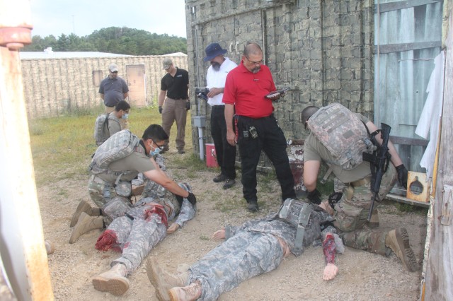 Members of the 807th Medical Command of Salt Lake City, Utah, work on medical mannequins while Medical Simulation Training Center (MSTC) staff members observe during a training scenario during the unit's 68W (combat medic specialist) refresher...