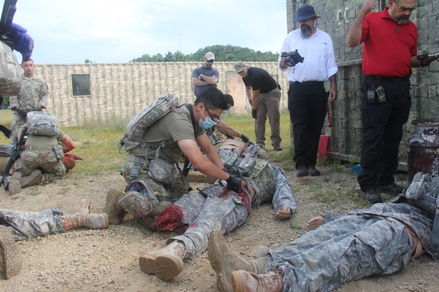 Members of the 807th Medical Command of Salt Lake City, Utah, work on medical mannequins while Medical Simulation Training Center (MSTC) staff members observe during a training scenario during the unit's 68W (combat medic specialist) refresher...