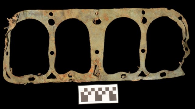 A copper and asbestos head gasket, most likely used in the 1910s, is shown here. The gasket was found eroding out of a hillside at a Fort McCoy historic site that was occupied from circa 1856 to 1912. (Photo by Colorado State University Center for...