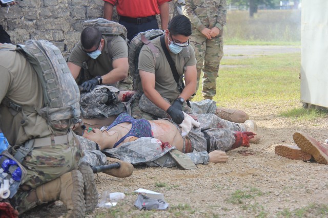 Members of the 807th Medical Command of Salt Lake City, Utah, work on medical mannequins while Medical Simulation Training Center (MSTC) staff members observe during a training scenario during the unit's 68W (combat medic specialist) refresher...