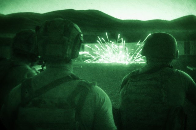 FORT WILLIAM HENRY HARRISON, Mont. – A Special Forces Soldier acts as safety as two Soldiers with the 3rd Battalion, 1st Special Forces Group (Airborne) fire at a steel target during a night-fire training event Sept. 3. 1st SFG (A) is supported...