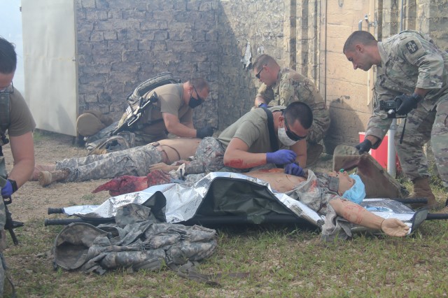 Members of the 807th Medical Command of Salt Lake City, Utah, work on medical mannequins while Medical Simulation Training Center (MSTC) staff members observe during a training scenario during the unit's 68W (combat medic specialist) refresher...