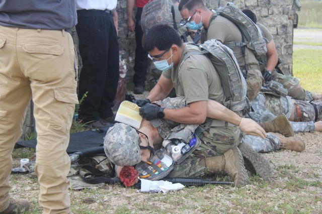 Members of the 807th Medical Command of Salt Lake City, Utah, work on medical mannequins while Medical Simulation Training Center (MSTC) staff members observe during a training scenario during the unit's 68W (combat medic specialist) refresher...