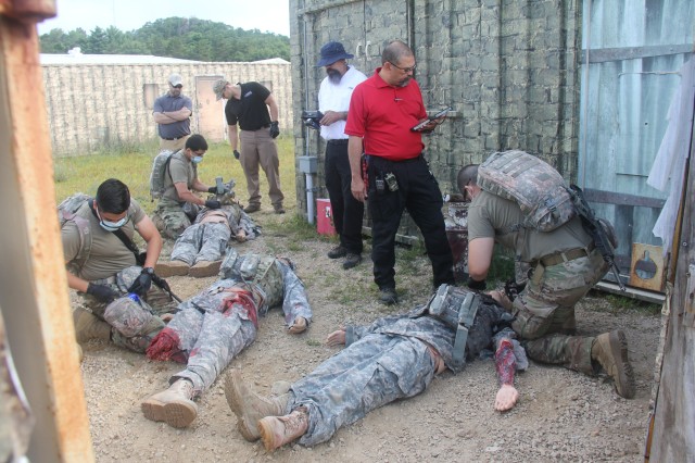 Members of the 807th Medical Command of Salt Lake City, Utah, work on medical mannequins while Medical Simulation Training Center (MSTC) staff members observe during a training scenario during the unit's 68W (combat medic specialist) refresher...