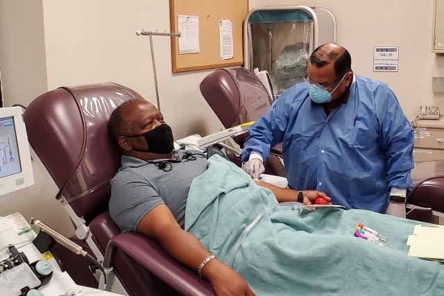 Richard Rangel, medical laboratory technician, prepares Thefety Tibbs, who was among the first donors of convalescent plasma, for his first convalescent plasma donation in June 2020 at the Akeroyd Blood Donor Center on Joint Base San Antonio Fort...