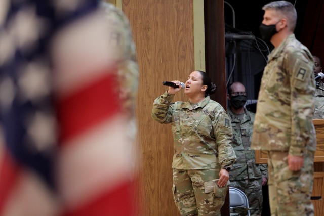 Staff Sgt. Natalie Romero, 5th Armored Brigade, sings the National Anthem during a Transfer of Authority ceremony at Fort Bliss, Texas, September 11, 2020. The 85th U.S. Army Reserve Support Command’s 1st Battalion, 338 Regiment, assumed the CONUS Replacement Center mission, supporting as 5th Armored Brigade’s “Viper 9”, the ninth rotation serving in this mission. The 94th Training Division’s 8th Battalion, 108th Regiment bid farewell during the ceremony as “Viper 8” to close out their rotation. The CRC mission is to take care of Soldiers, DA Civilians and contractors that go through the mobilization process, individually, ahead of overseas deployments and assignments. This was the first unit assigned to the 85th USARSC to mobilize for this effort after receiving the mission from Army Reserve Command.
(U.S. Army Reserve photo by Master Sgt. Anthony L. Taylor)