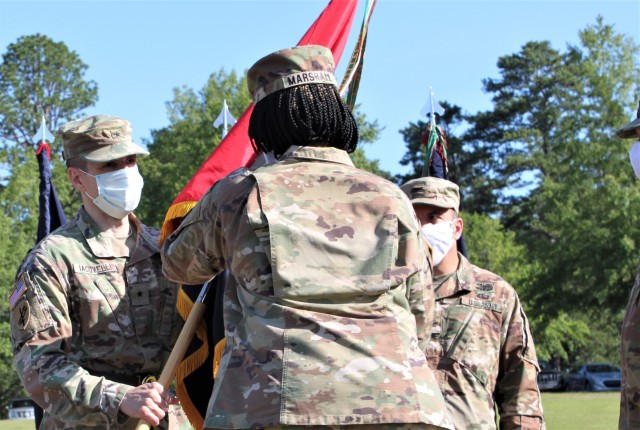 Col. Janene Marshall-Gatling, outgoing 4th Brigade (Personnel Services) commander (right), passes the 4th Brigade (PS) unit guidon to Brig. Gen. Stephen Iacovelli (left), 94th Training Division-Force Sustainment commanding general, as she relinquished command of the brigade during the unit’s change of command ceremony held on Victory Field at Fort Jackson, S.C., July 11, 2020. Marshall-Gatling served as the 4th Brigade (PS) commander for two years prior to her relinquishment of command to Col. Aaron Wilkes. (U.S. Army Reserve photo courtesy of 1st Lt. Matthew Rutledge, 4th Brigade (PS), 94th TD-FS)