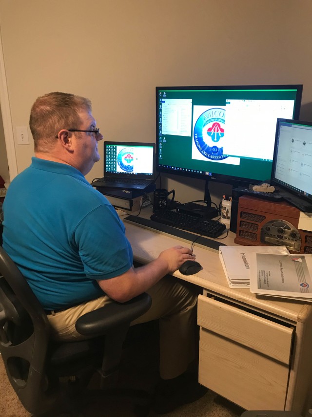 Adam Mathis, AMCOM G1 Training and Career Development Division, sits at his home workstation while working a telework schedule, September 2020. During the COVID-19 pandemic, a large number of AMCOM employees conduct their duties through a telework...