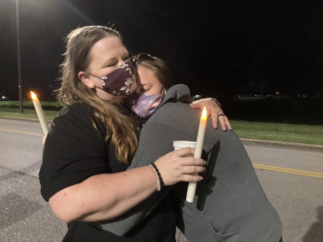 Cynthia Langa hugs her daughter, Kylee, 15, during the second annual Light Up the Night  Sept. 10, outside Blanchfield Army Community Hospital. Cynthia walked in memory of her sister, Michelle A. McGibbon, who committed suicide in 2018.