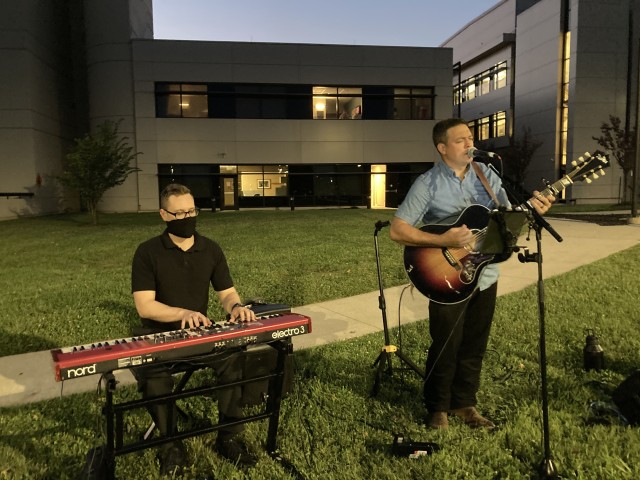 Specialist Erik Lofgren, left,  plays keyboard while Spc. Robbie McMillan, sings and plays guitar Sept. 10 during the second annual Light up the Night outside Blanchfield Army Community Hospital. Both Soldiers are members of the 101st Airborne...
