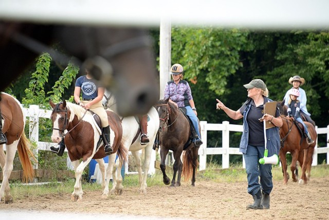 Eight Easy Lessons to Foxhunting instructor Gayle Rue guides riders through basic maneuvers, including walking, trotting and passing other riders, during the first of the Fort Leavenworth Hunt's free pre-season series of classes for riders new or...