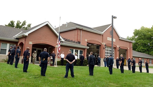 Fort Leavenworth Directorate of Emergency Services and Garrison staff members assemble for a minute of silence to remember first responders who lost their lives on Sept. 11, 2001, during a remembrance ceremony Sept. 11 in front of Fire Station No. 2. Other area 9-11 observances included a Unified School District 207 virtual Freedom Walk, viewable on the USD 207 website, and a moving tribute by Team Red, White and Blue at Ray Miller Park in Leavenworth. Photo by Prudence Siebert/Fort Leavenworth Lamp