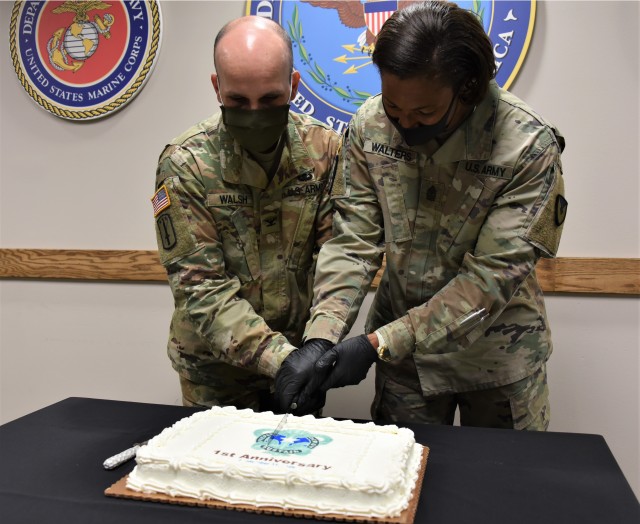 Deputy Commander Col. Timothy Walsh and Sgt. Maj. Danyell Walters cut a cake to mark the first anniversary of U.S. Army Medical Logistics Command. AMLC was officially activated Sept. 17, 2019 as the Army’s primary medical logistics and sustainment command, responsible for managing the global supply chain and medical materiel readiness across the total force.