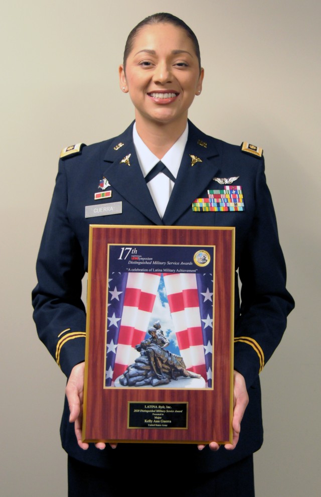 First Army senior physician assistant, Maj. Kelly Ann Guerra, stand with her 2020 Latina Style, Inc., Distinguished Military Service Award plaque.