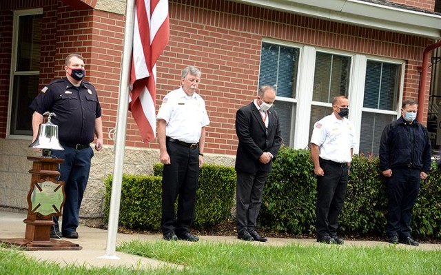 Fort Leavenworth Fire and Emergency Services Fire Capt. Richard Baggett, Fire Chief William Maciorowski, Deputy Director of Emergency Services Ryan Dickerson, Assistant Fire Chief Kevin Seymour and Chief of Police Robert Ruskievicz stand in front of Fire Station No. 2 for a minute of silence to remember first responders who lost their lives on Sept. 11, 2001, during a short ceremony Sept. 11 at the station. Photo by Prudence Siebert/Fort Leavenworth Lamp