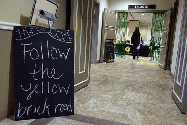 New and returning Fort Leavenworth Spouses Club members enter the ballroom to follow the "yellow brick road," marked in yellow tape along a route leading from one informational booth to the next, during the FLSC Super Sign-up Sept. 9 at the...