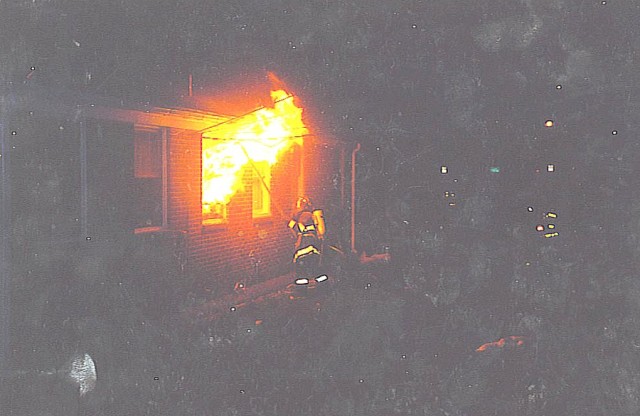 Firefighter Richard “Bruce” Van Hine helps fight a fire as a member of the West Point Fire Department in the early ‘90s. (Photo courtesy of Jerry Kiernan/retired WPFD firefighter)