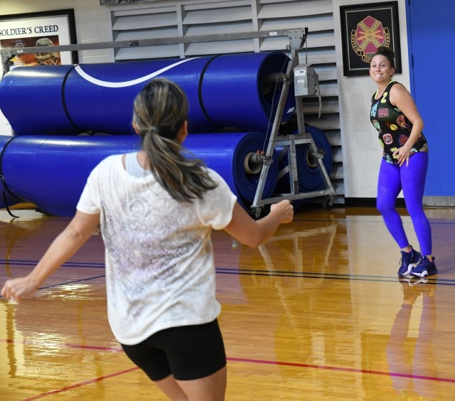 Alyssa Wolfe keeps the energy high and the music loud during a recent Zumba class at Magrath Sports Complex. (Photo by Mike Strasser, Fort Drum Garrison Public Affairs)