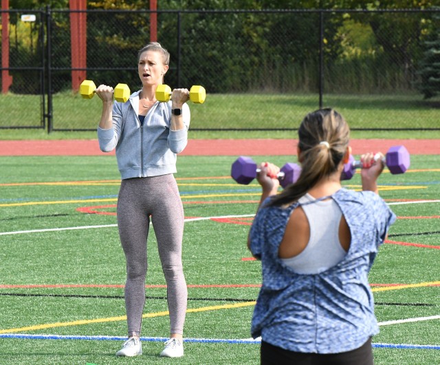 Traci Bickelhaupt guides a group through an outdoor session of the Functional Fitness class, scheduled twice weekly at Magrath Sports Complex. This is one of three different classes offered through Fort Drum Family and Morale, Welfare and...