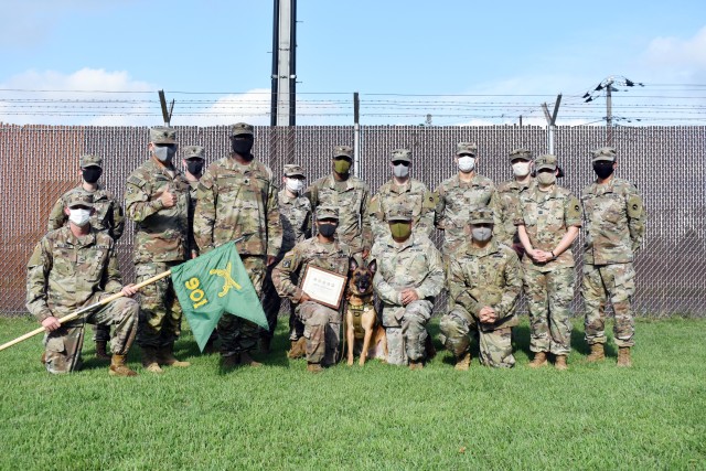 Members of the 901st Military Police Detachment, Lt. Col. Demetrick Thomas and Command Sgt. Maj. Edgar Rodriguez, command team of the 35th Combat Sustainment Support Battalion, as well as Soldiers from the Camp Zama Veterinary Treatment Facility, pose for a photo with Sgt. 1st Class Vito during Vito’s retirement ceremony at Camp Zama, Japan, Sept. 17.