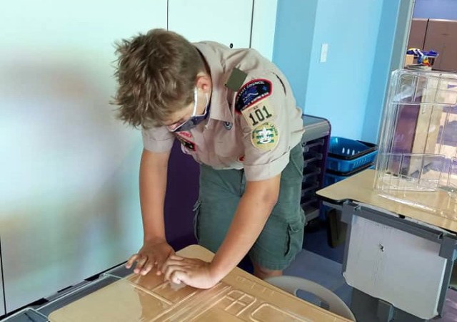 Colton Gleason prepares plastic barriers for Zukeran Elementary School in Camp Foster, Okinawa, in August, to enable schools to open for COVID-19. He also organized and led volunteers to set up the barriers.