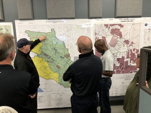 Fort Hunter Liggett emergency director Shawn Sullivan provides fire update briefs twice a day, and as needed, to garrison staff and tenant representatives at the emergency operations center. Photo by Amy Phillips, PAO