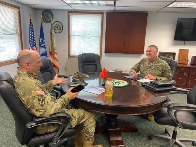 Fort McCoy Garrison Commander Col. Mike Poss (right) meets with First Army Deputy Commanding General Maj. Gen. Rodney Faulk on Aug. 5, 2020, at Fort McCoy, Wis. The two met to discuss the installation’s training capabilities and future opportunities for First Army Soldiers. Faulk also observed training taking place at the installation during his visit. (U.S. Army Photo by Christopher Hanson, Public Affairs Office, Fort McCoy, Wis.)