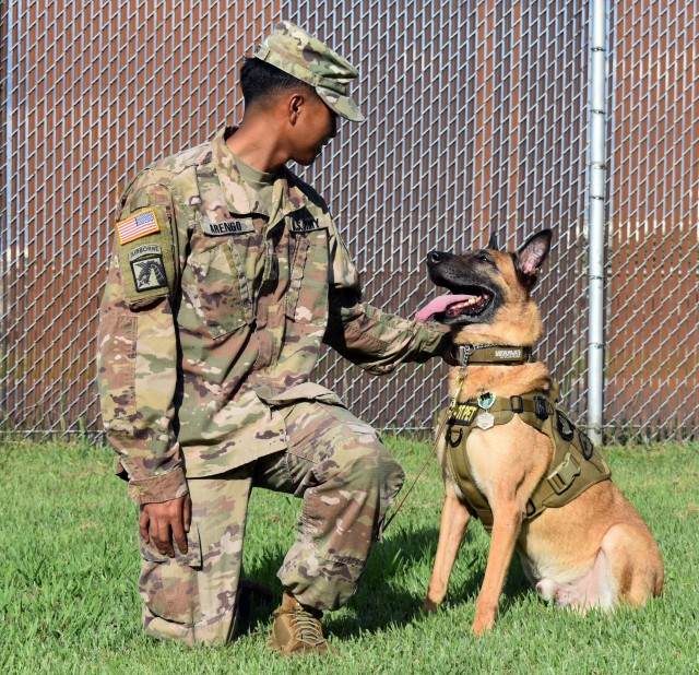 Spc. Jericho Arengo, assigned to the 901st Military Police Detachment, poses for a photo with Sgt. 1st Class Vito, during Vito’s retirement ceremony at Camp Zama, Japan, Sept. 17.