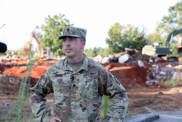 Staff Sgt. Westley Dozier,  a horizontal equipment operator with the 878th Engineer Battalion out of Augusta, Georgia, talks about how his Soldiers get necessary training on their equipment while helping the garrison's Directorate of Public Works.