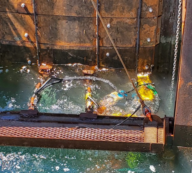 A diver from the U.S. Army Corps of Engineers Buffalo District contractor Great Lakes Dock and Materials, LLC works on a repair panel along one of the Lorain Harbor breakwater's sheet pile cells, Lorain, OH, July 14, 2020.