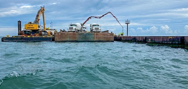 View of the U.S. Army Corps of Engineers Buffalo District contractor Great Lakes Dock and Materials, LLC working on new cell construction at the Lorain Harbor breakwater, Lorain, OH, July 21, 2020.
...
