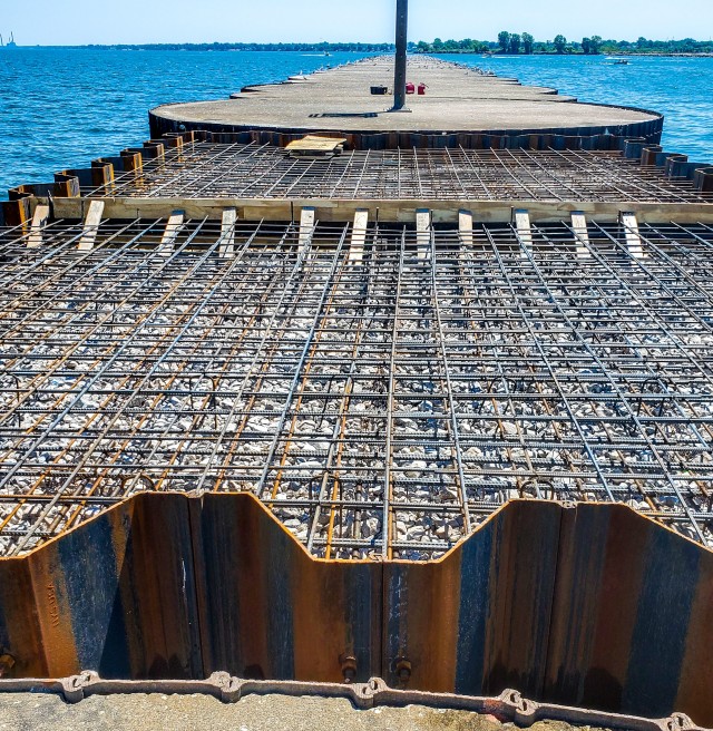 U.S. Army Corps of Engineers Buffalo District contractor Great Lakes Dock and Materials, LLC works on new cell construction and rebar layout at the Lorain Harbor breakwater, Lorain, OH, July 18, 2020.
...